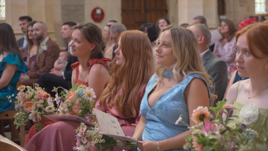 bridesmaids holding flowers in the church