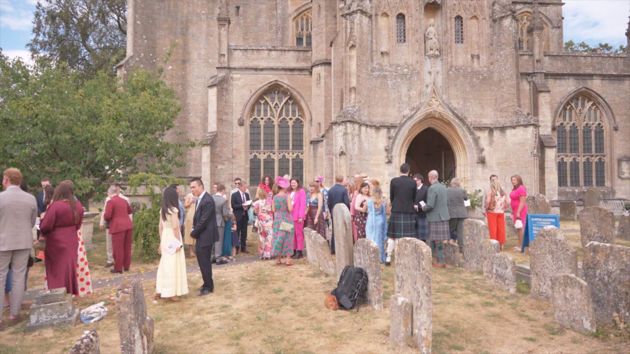 wedding guests outside the church