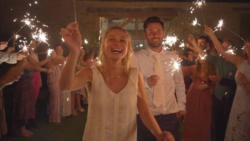 sparklers at the end of the wedding, bridge and groom walking